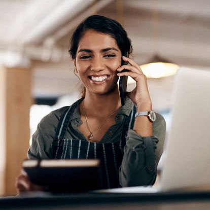 Smiling woman talking on the phone