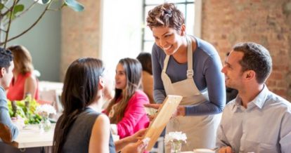 Server taking a customer's order at a restaurant