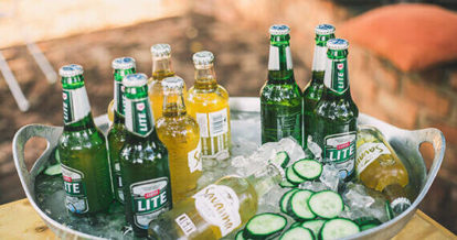 A selection of ciders chilling in a bin of ice