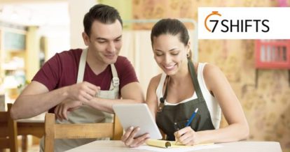 Photo of 2 restaurant staff working at a table and a 7shifts logo in the top right corner of photo