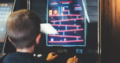 restaurant goer playing arcade game