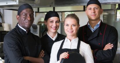 Front and back of house staff smiling