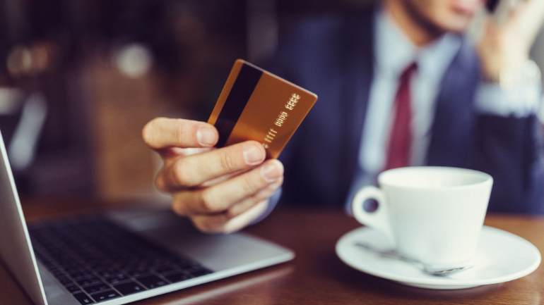 Customer paying for coffee with a credit card