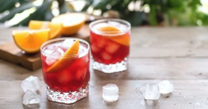 Two glasses of cocktails on a table outside