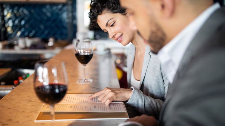 A couple looking at a menu together