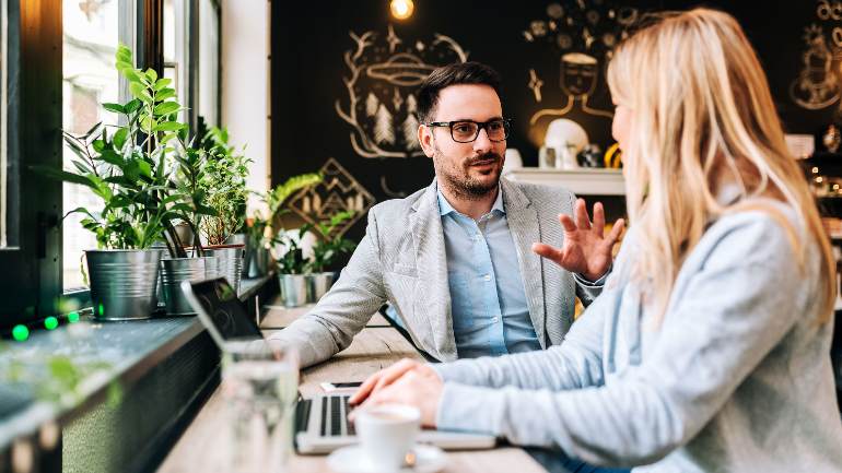 Restaurant manager speaking to a customer