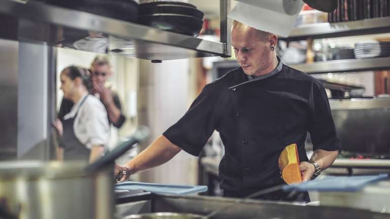 Chef prepping food in kitchen