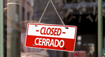 Closed sign on restaurant door