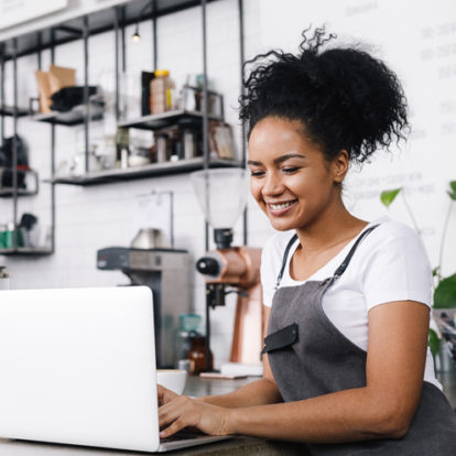 Restaurant owner on laptop