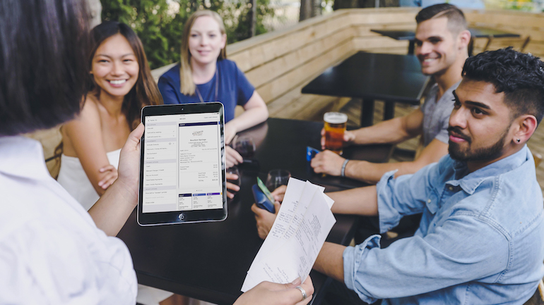 Restaurant server using TouchBistro Tableside Payment.